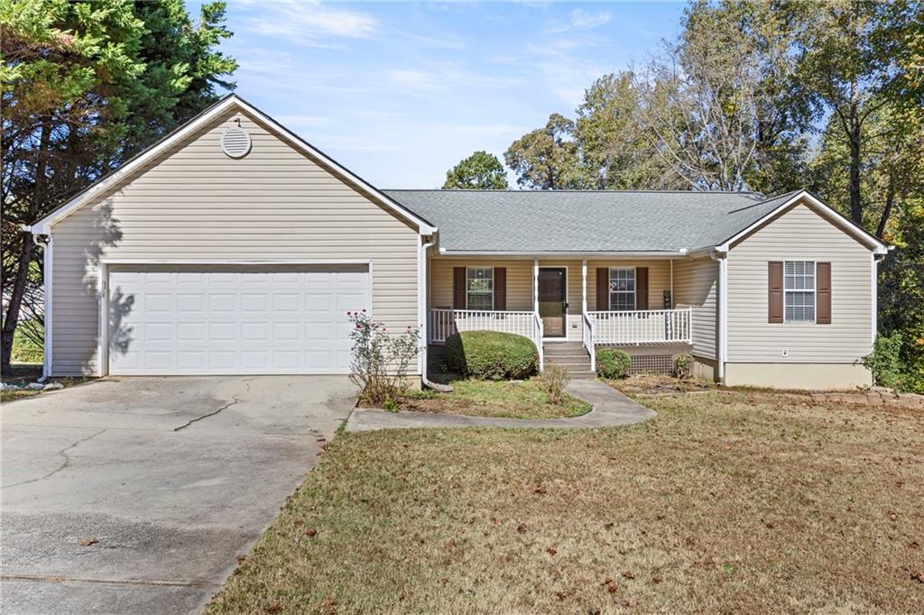 917 Heritage Ridge Court Monroe, GA 30655 - Photo 1 of 1 a front view of a house with a yard and garage