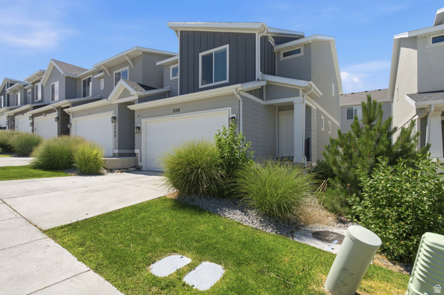 3788 South Galatia Road Magna, UT 84044 - Photo 2 of 24 Contemporary exterior with multi-toned siding, integrated garage, covered entry, and landscaped frontage