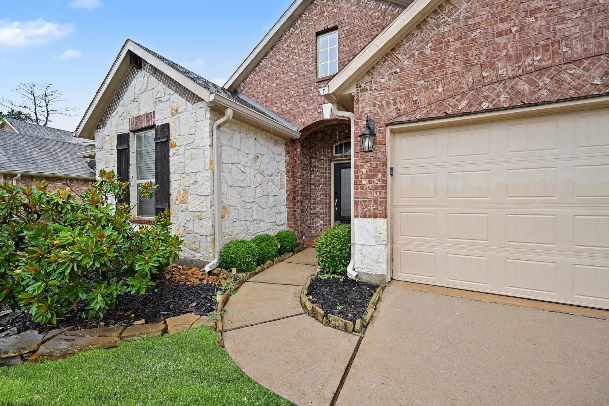 24554 Grayson Falls Lane Spring, TX 77389 - Photo 4 of 27 a front view of a house with garden