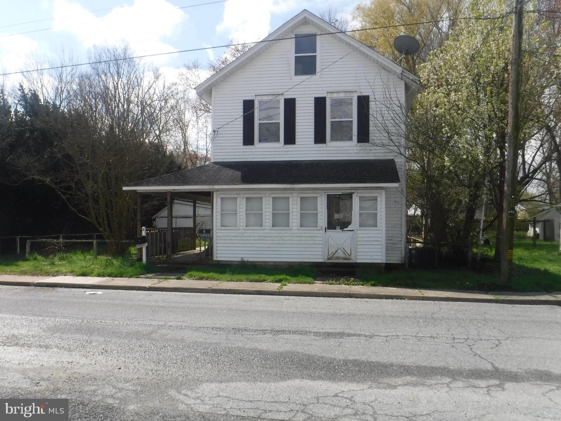 3 Mill Street Harrington, DE 19952 - Photo 1 of 25 a front view of house with yard and trees