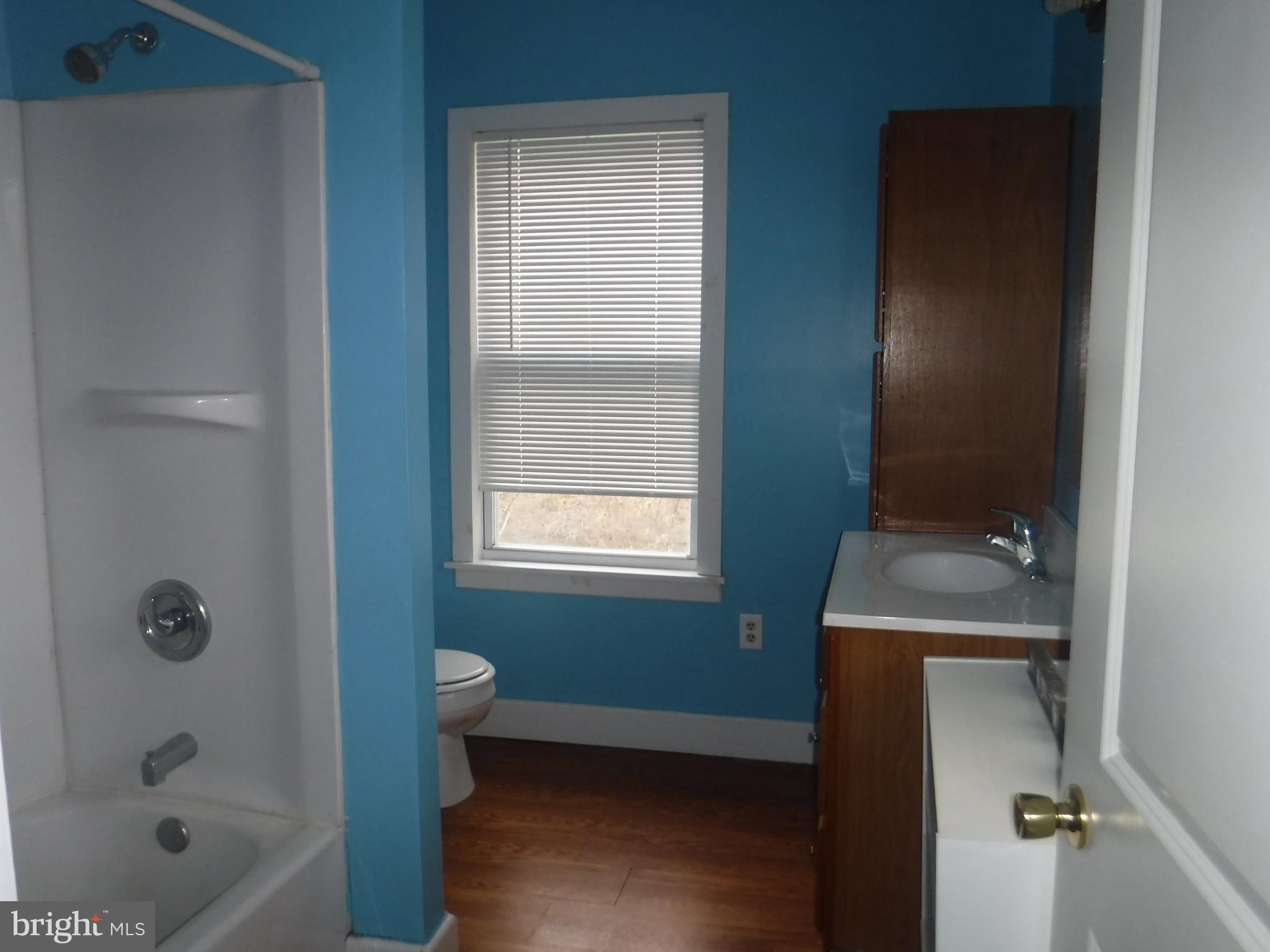3 Mill Street Harrington, DE 19952 - Photo 19 of 25 a bathroom with a bathtub