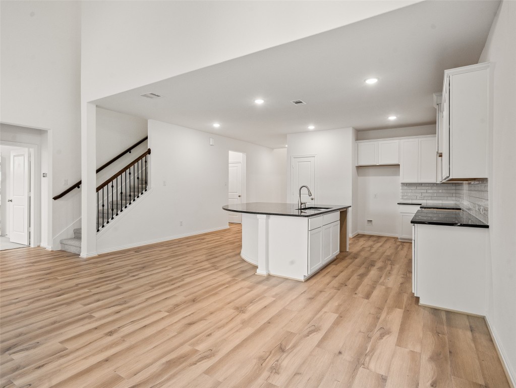 306 Strm Bnd Way Rosenberg, TX 77471 - Photo 14 of 35 a view of kitchen with wooden floor and electronic appliances