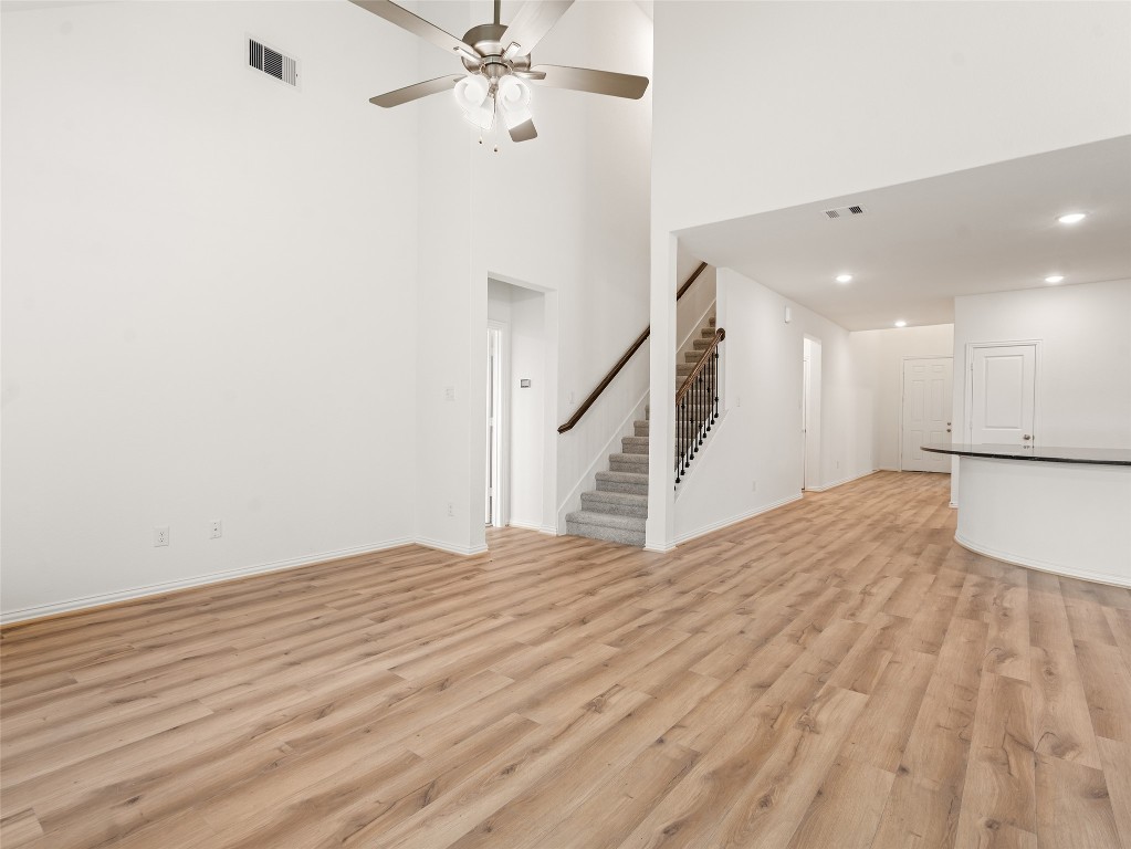 306 Strm Bnd Way Rosenberg, TX 77471 - Photo 16 of 35 a view of empty room with wooden floor and fan