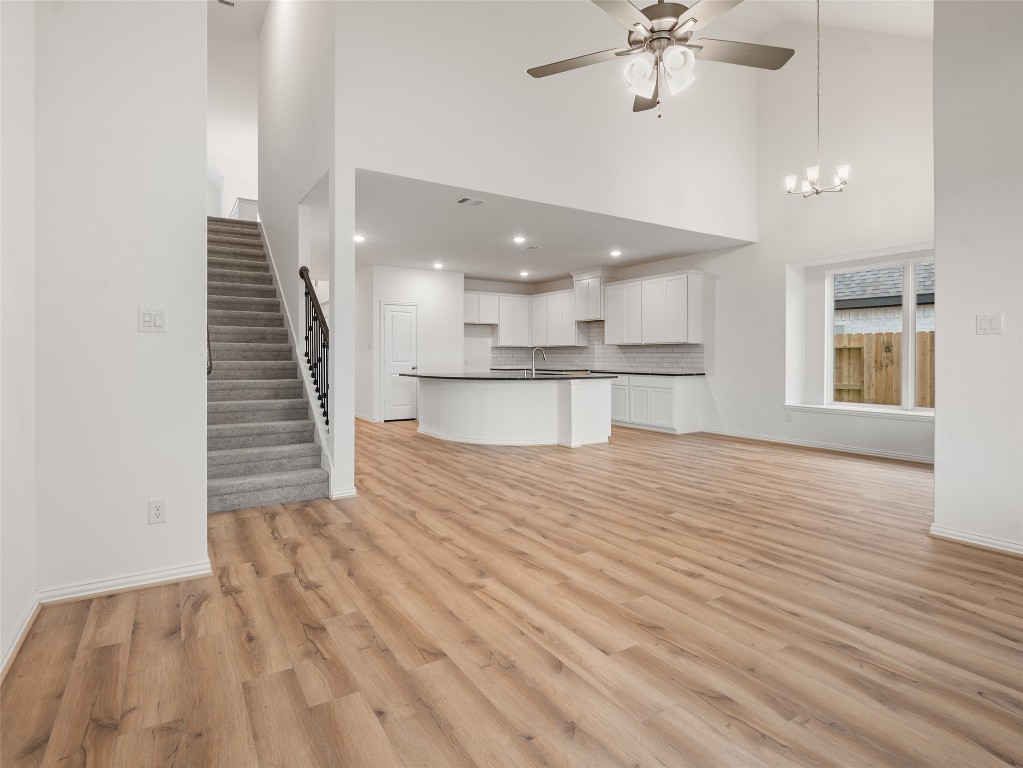 306 Strm Bnd Way Rosenberg, TX 77471 - Photo 17 of 35 wooden floor in an empty room with a window