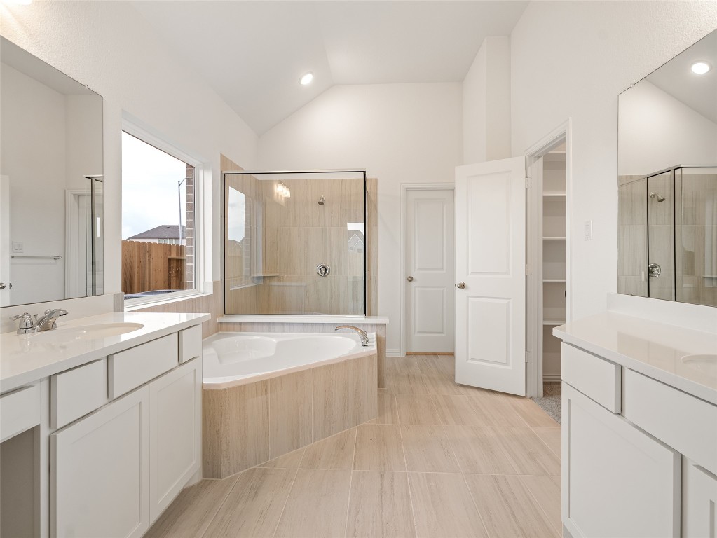 306 Strm Bnd Way Rosenberg, TX 77471 - Photo 20 of 35 a spacious bathroom with a tub sink shower and mirror