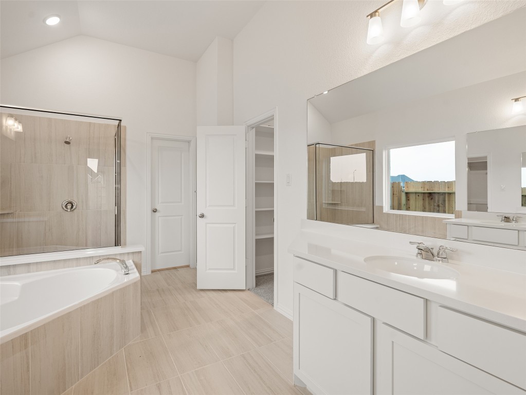 306 Strm Bnd Way Rosenberg, TX 77471 - Photo 21 of 35 a bathroom with a bathtub shower sink and mirror