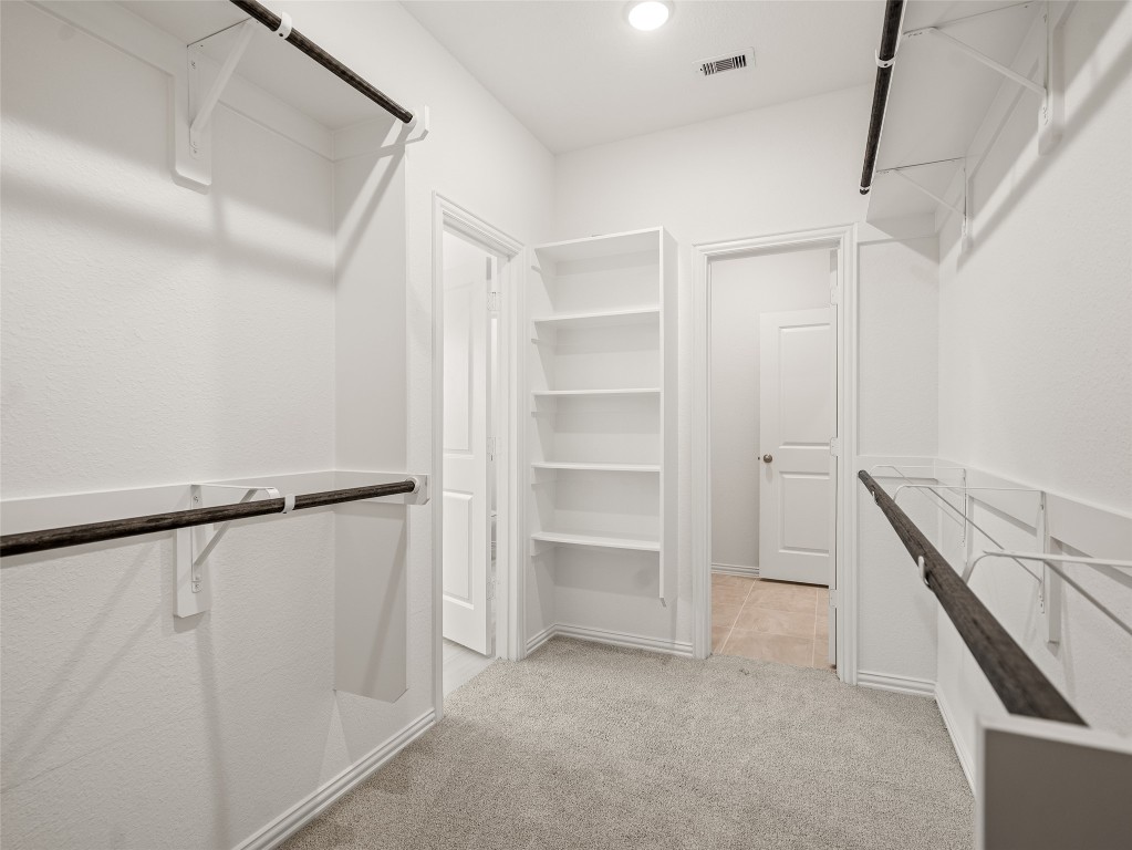 306 Strm Bnd Way Rosenberg, TX 77471 - Photo 23 of 35 a view of an empty walk in closet