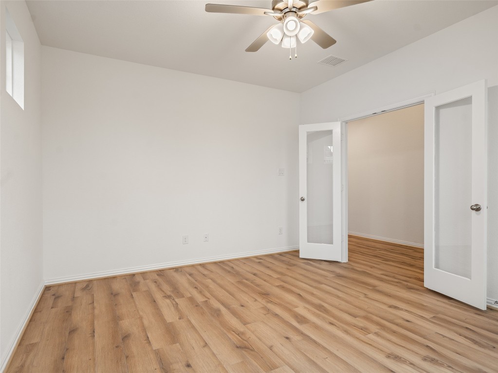 306 Strm Bnd Way Rosenberg, TX 77471 - Photo 7 of 35 wooden floor in an empty room