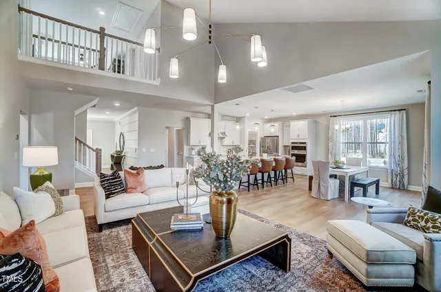 a living room with furniture and a table
