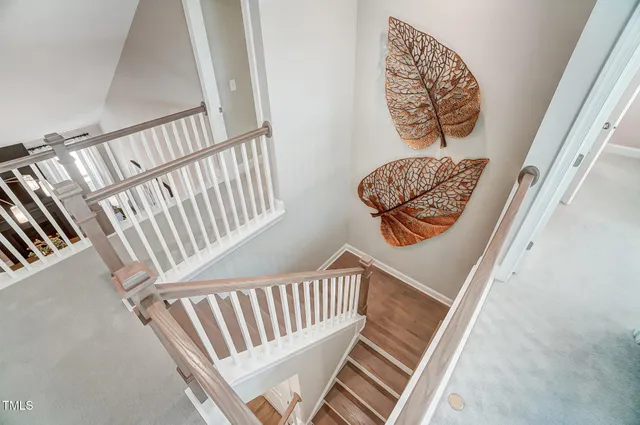 a living room with furniture a window and a chandelier