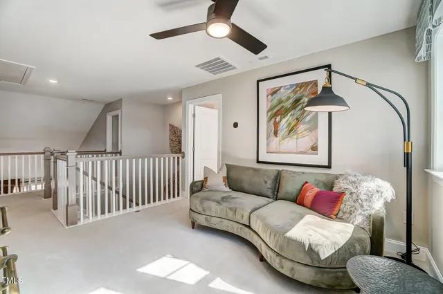 a bedroom with a bed and a lamp