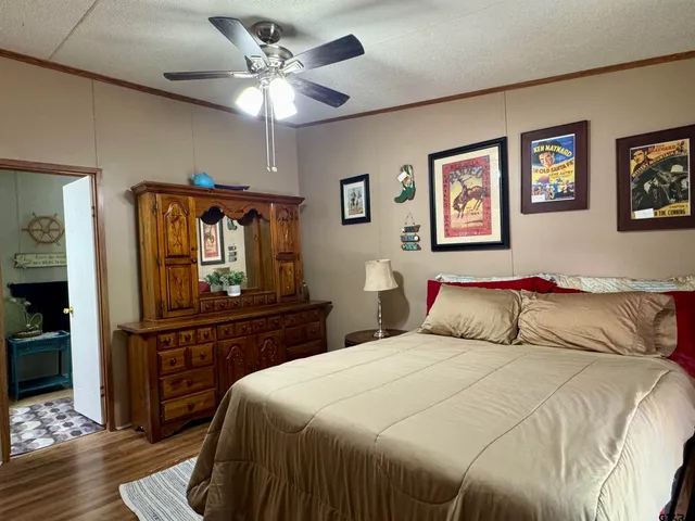 a bedroom with a bed and a dresser