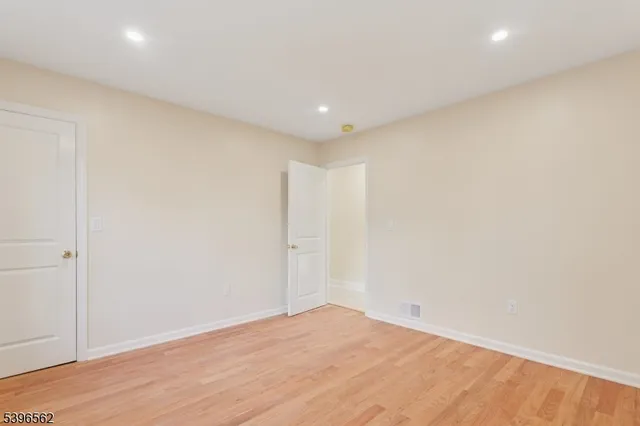 a bathroom with a shower sink vanity and mirror
