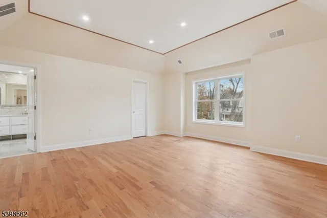 a bathroom with a granite countertop sink a toilet and a shower