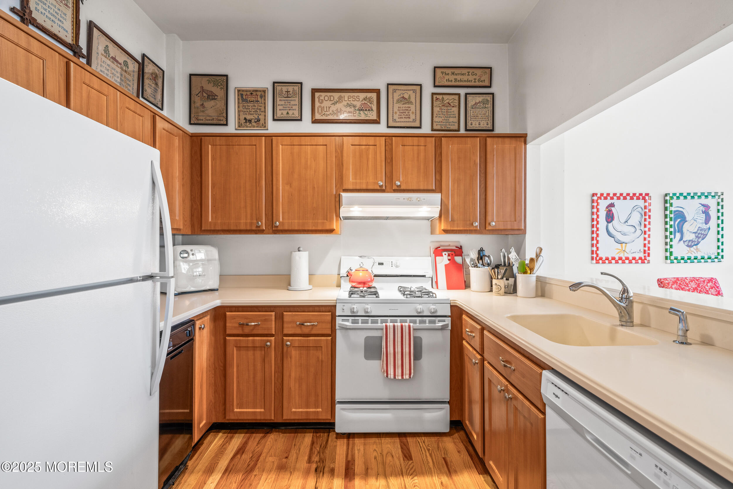 4 Ocean Avenue, Unit 5 Ocean Grove, NJ 07756 - Photo 14 of 81 a kitchen with a sink a stove and cabinets