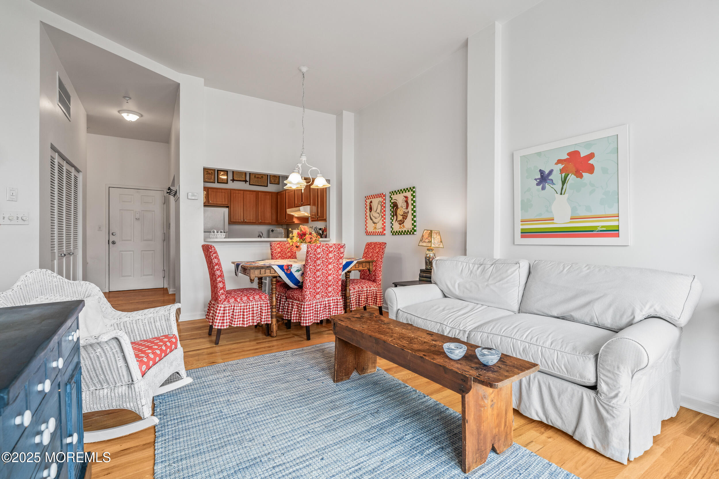 4 Ocean Avenue, Unit 5 Ocean Grove, NJ 07756 - Photo 21 of 81 a living room with furniture and a wooden floor