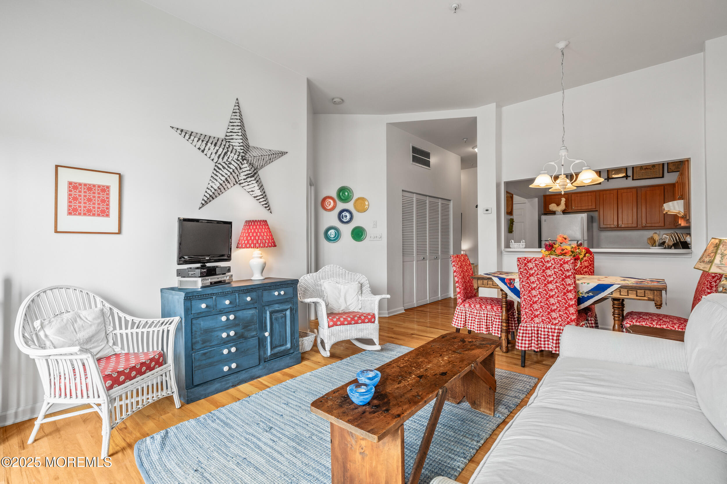 4 Ocean Avenue, Unit 5 Ocean Grove, NJ 07756 - Photo 22 of 81 a living room with furniture a flat screen tv and a table