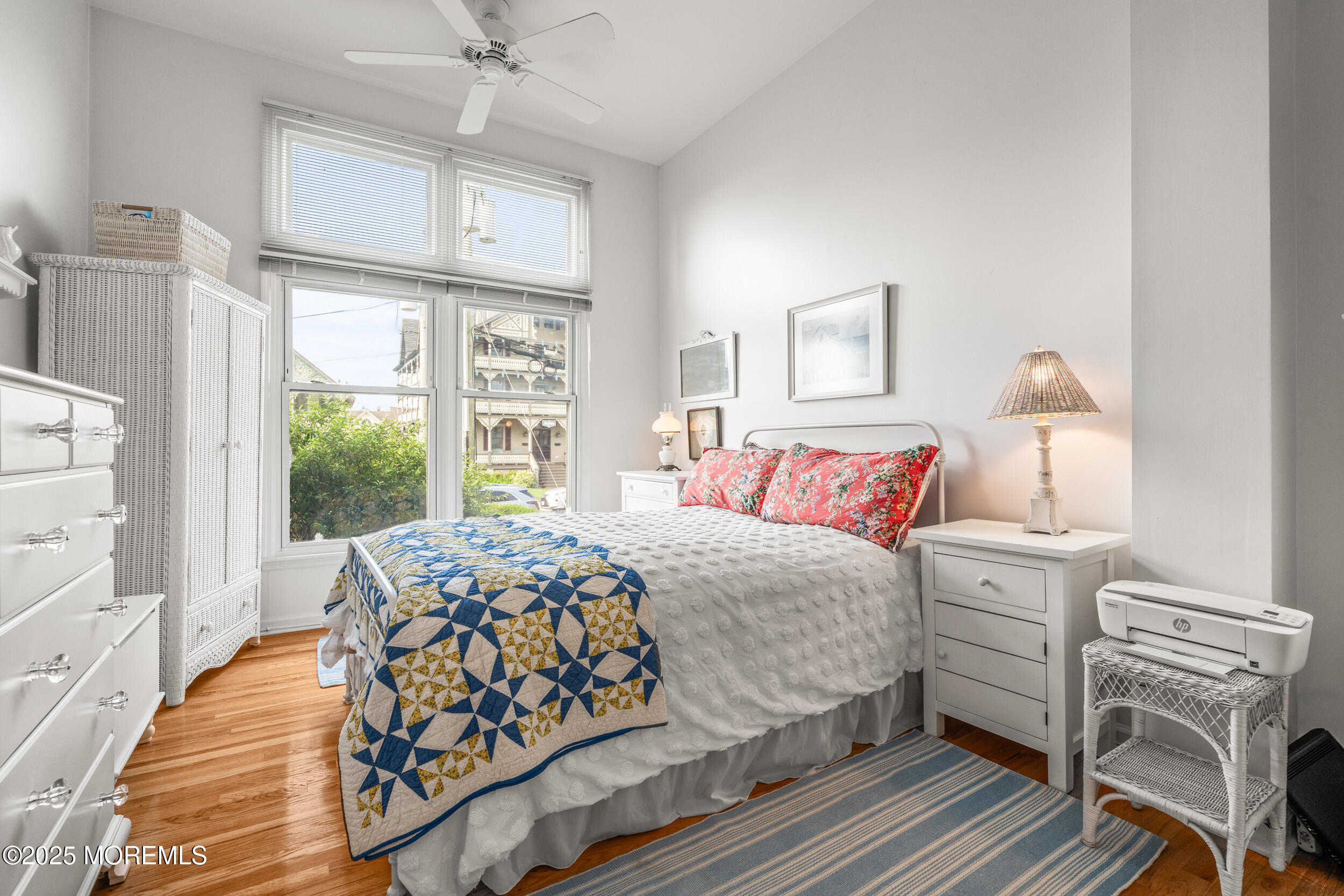 4 Ocean Avenue, Unit 5 Ocean Grove, NJ 07756 - Photo 27 of 81 a bedroom with a bed and a window with chair