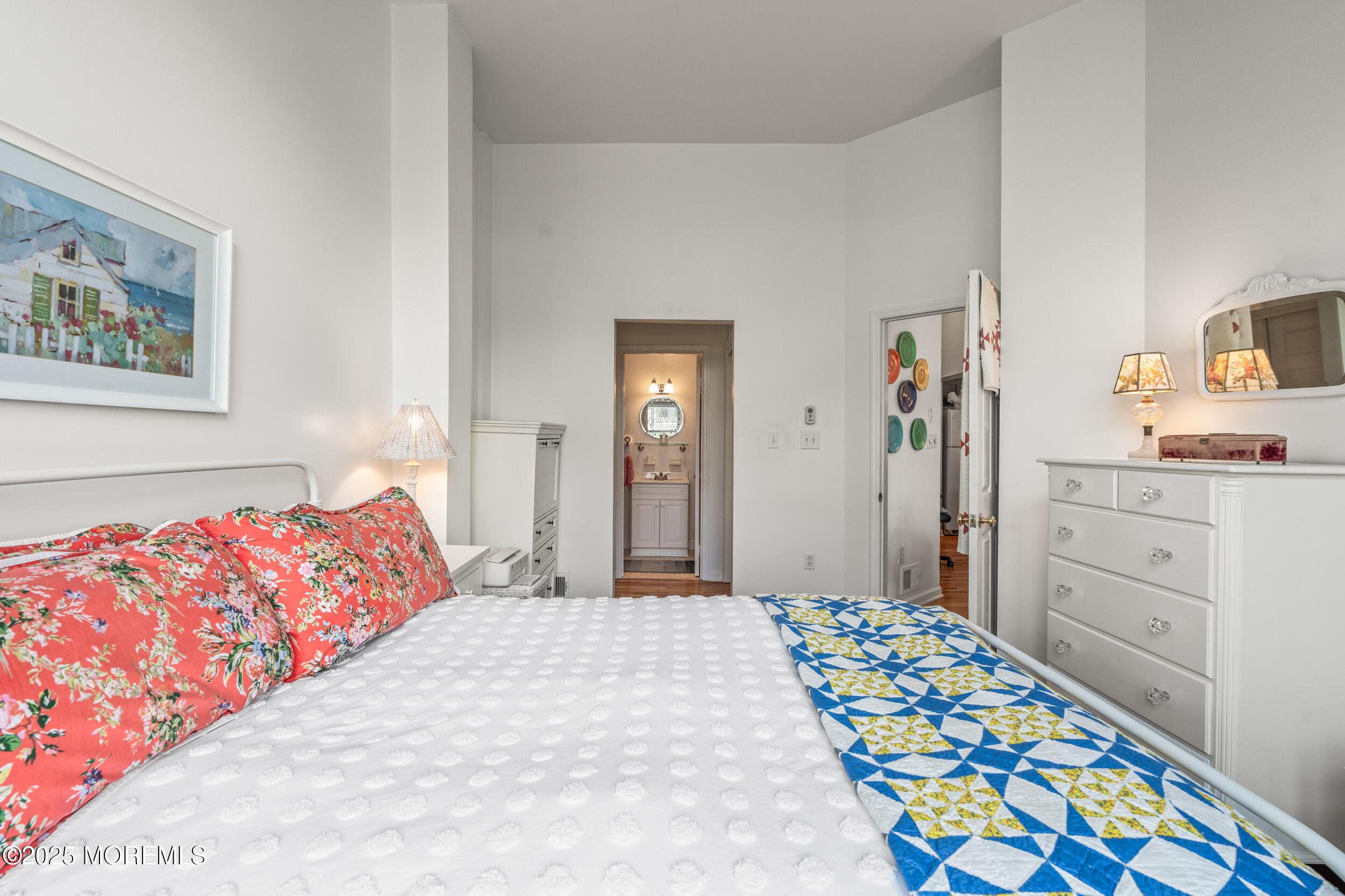 4 Ocean Avenue, Unit 5 Ocean Grove, NJ 07756 - Photo 29 of 81 a bedroom with bed and painting on the wall