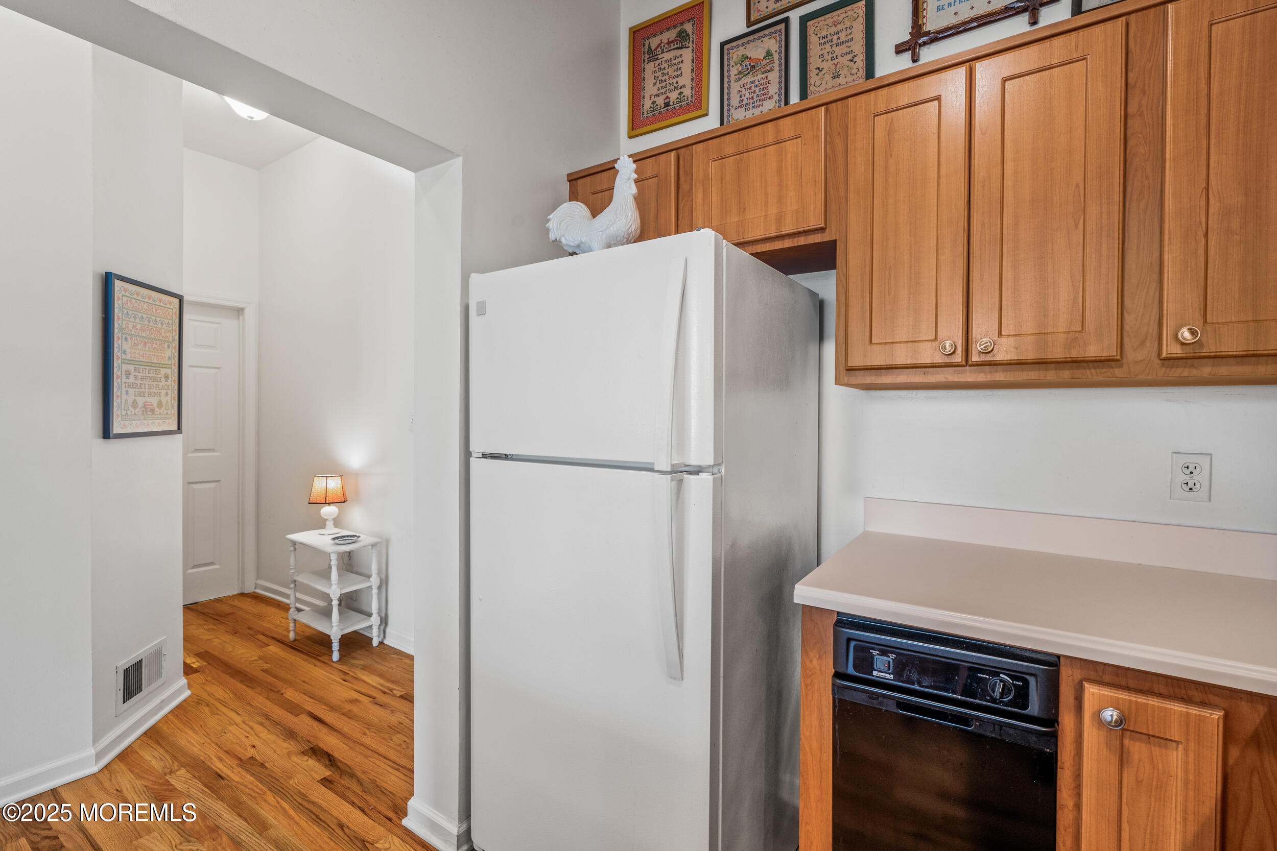 4 Ocean Avenue, Unit 5 Ocean Grove, NJ 07756 - Photo 10 of 81 a kitchen with a refrigerator and a stove