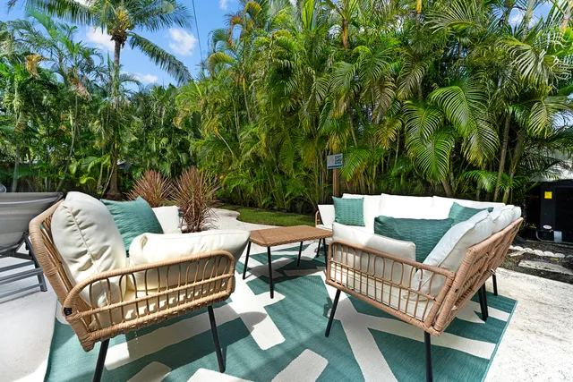 a view of a patio with a yard