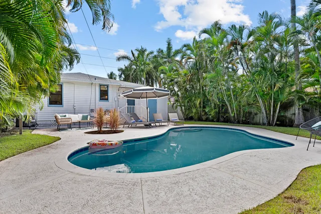 a view of a swimming pool with chairs