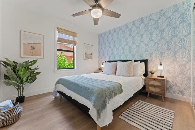 a bedroom with bed and a window