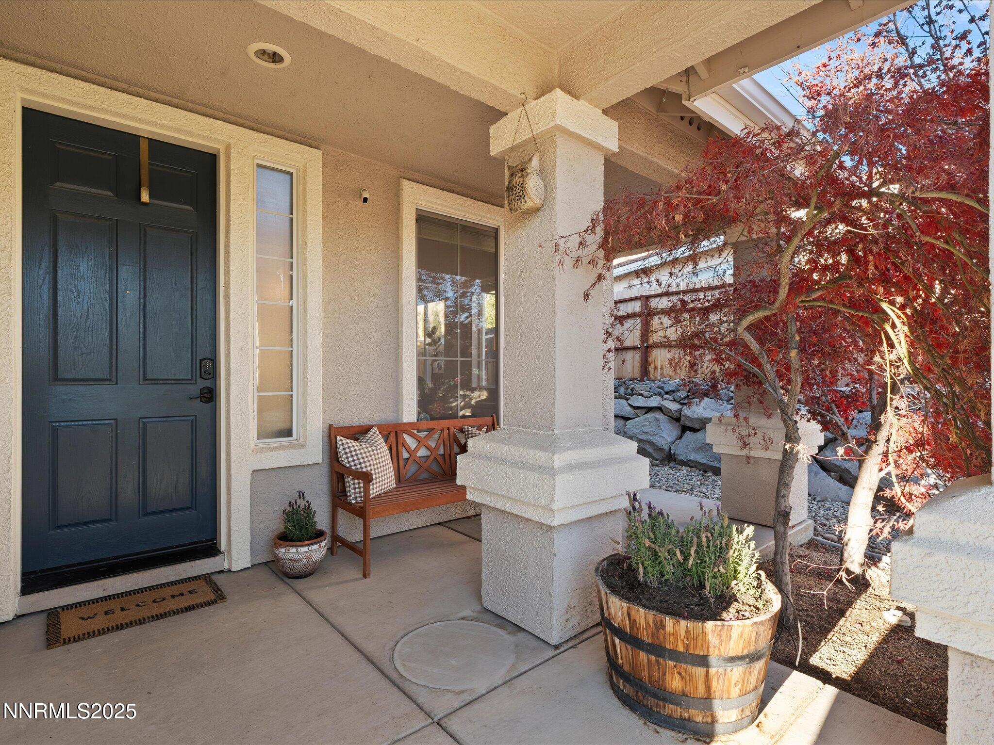 7227 Heatherwood Drive Reno, NV 89523 - Photo 11 of 55 a living room with furniture and a potted plant