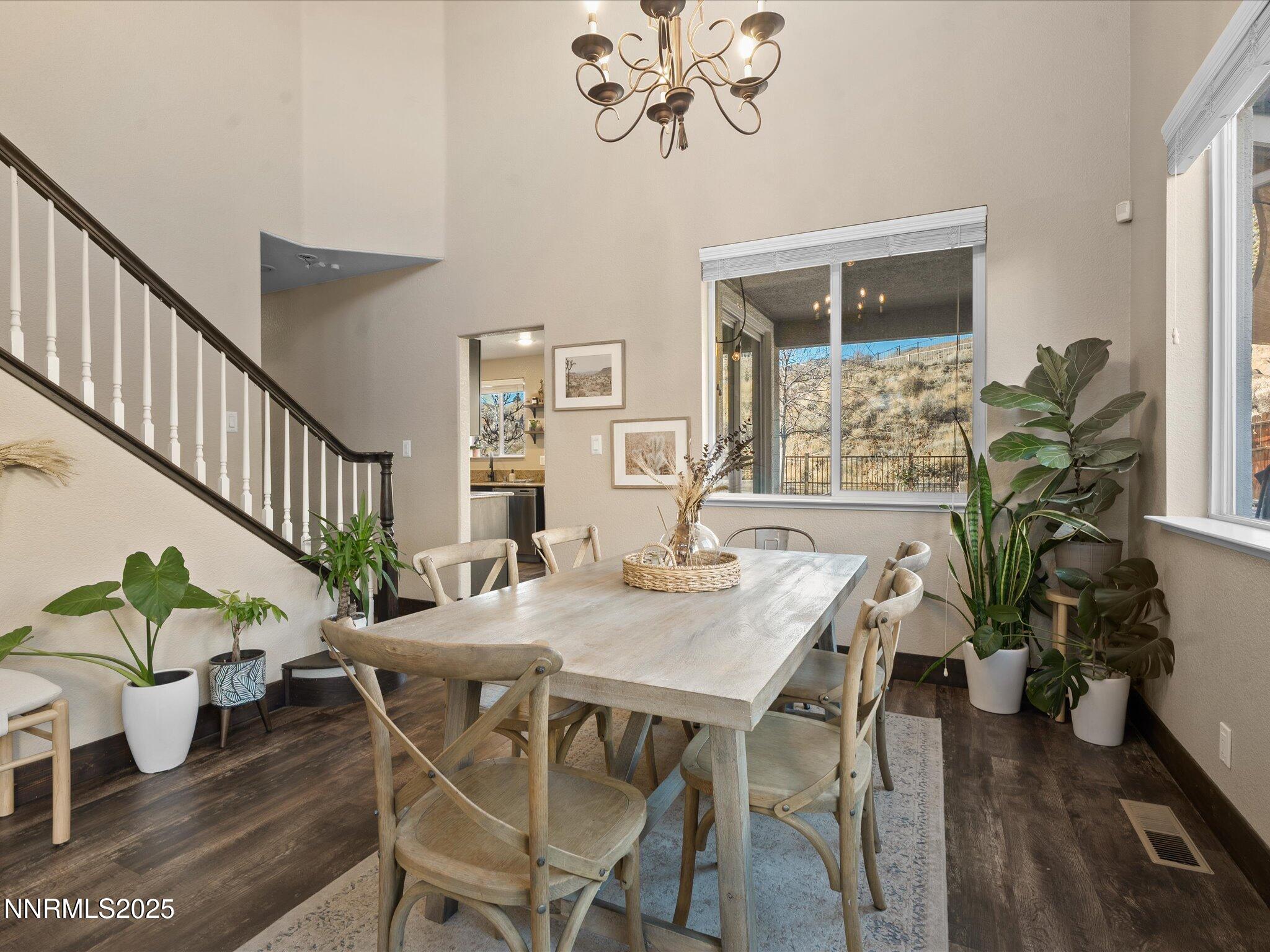 7227 Heatherwood Drive Reno, NV 89523 - Photo 15 of 55 a view of a dining room with furniture window and wooden floor