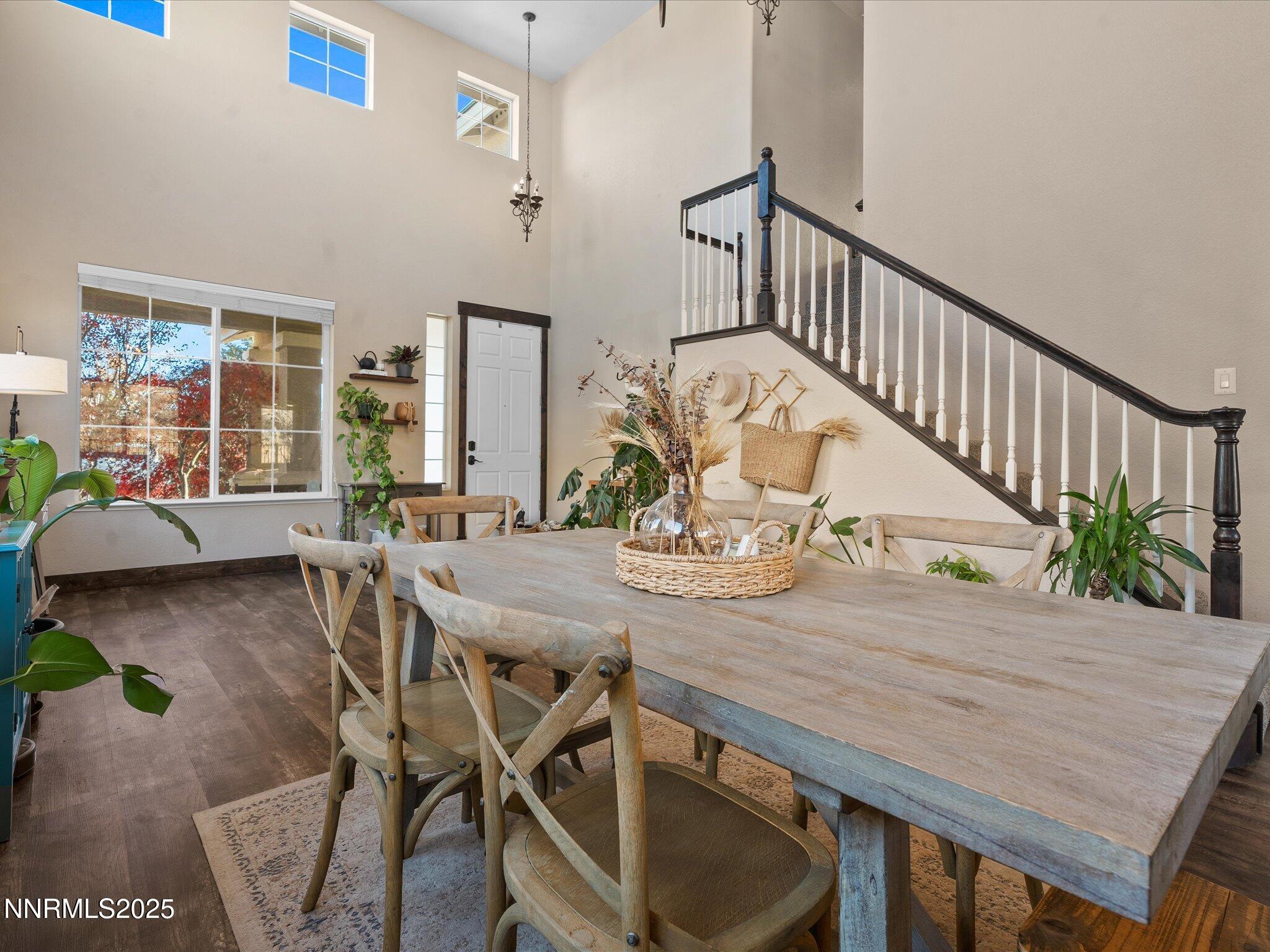 7227 Heatherwood Drive Reno, NV 89523 - Photo 16 of 55 a view of a dining room and livingroom with furniture wooden floor a chandelier