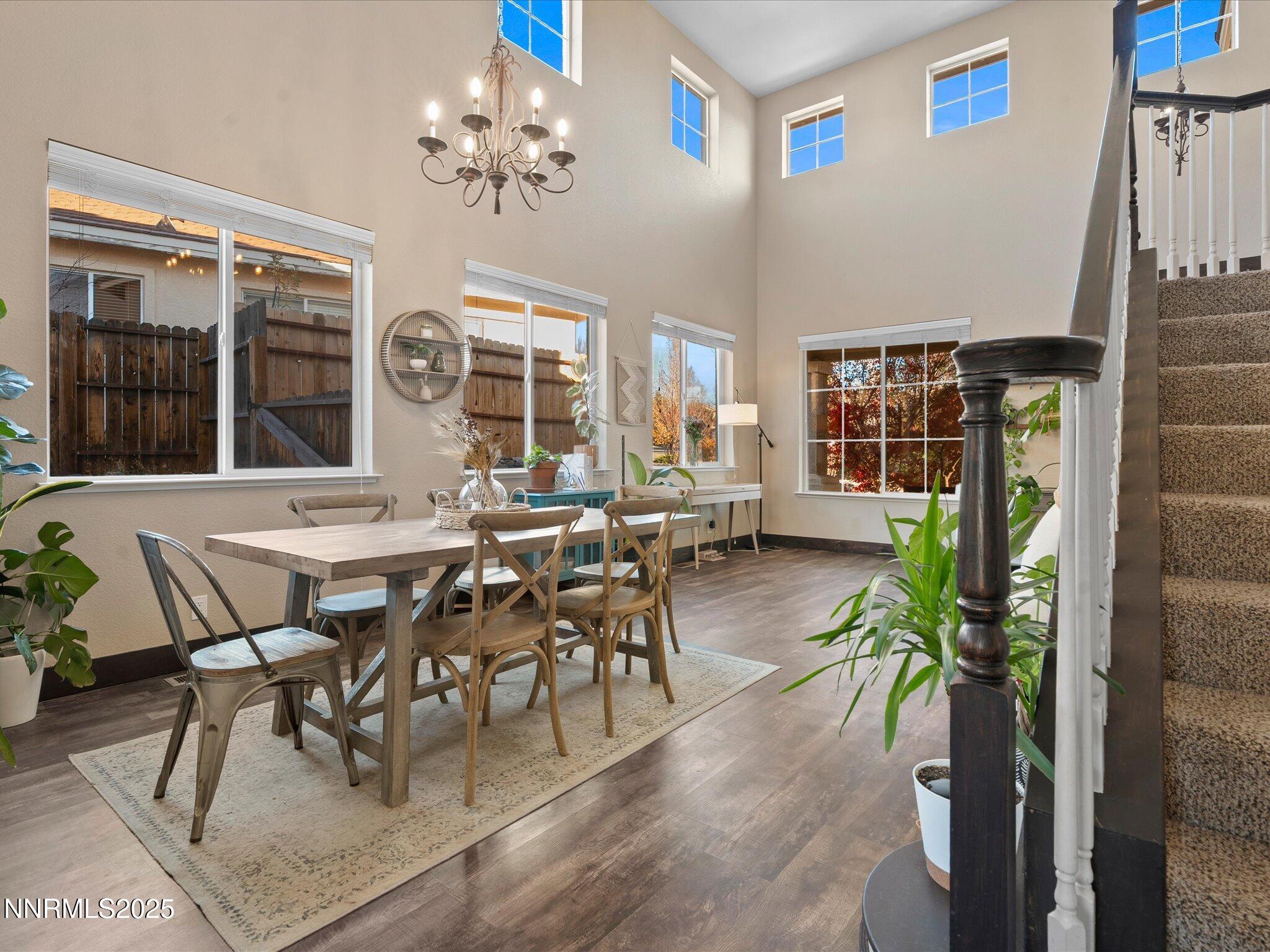 7227 Heatherwood Drive Reno, NV 89523 - Photo 18 of 55 a view of a dining room with furniture and chandelier