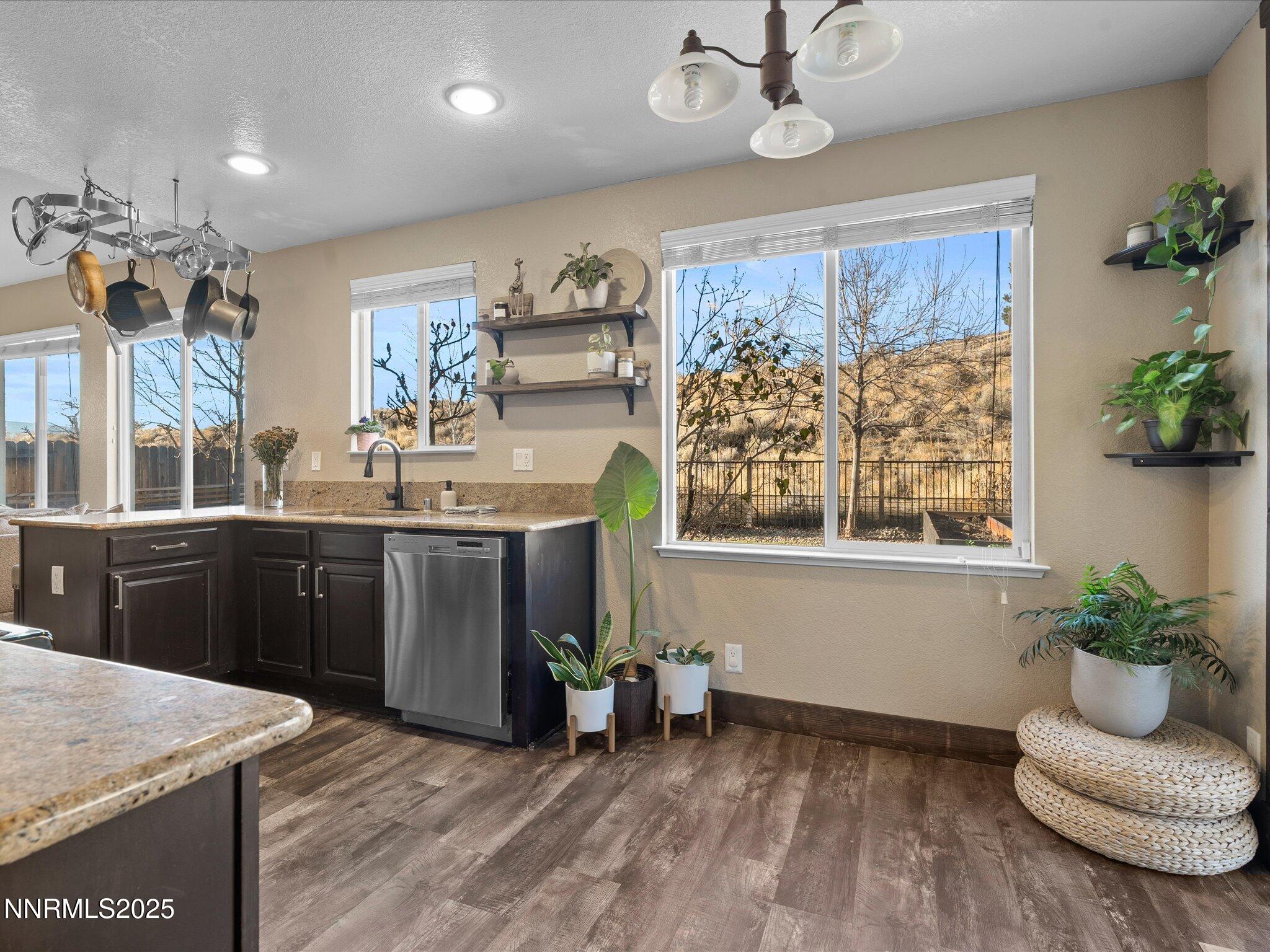 7227 Heatherwood Drive Reno, NV 89523 - Photo 19 of 55 a kitchen with a refrigerator and a stove