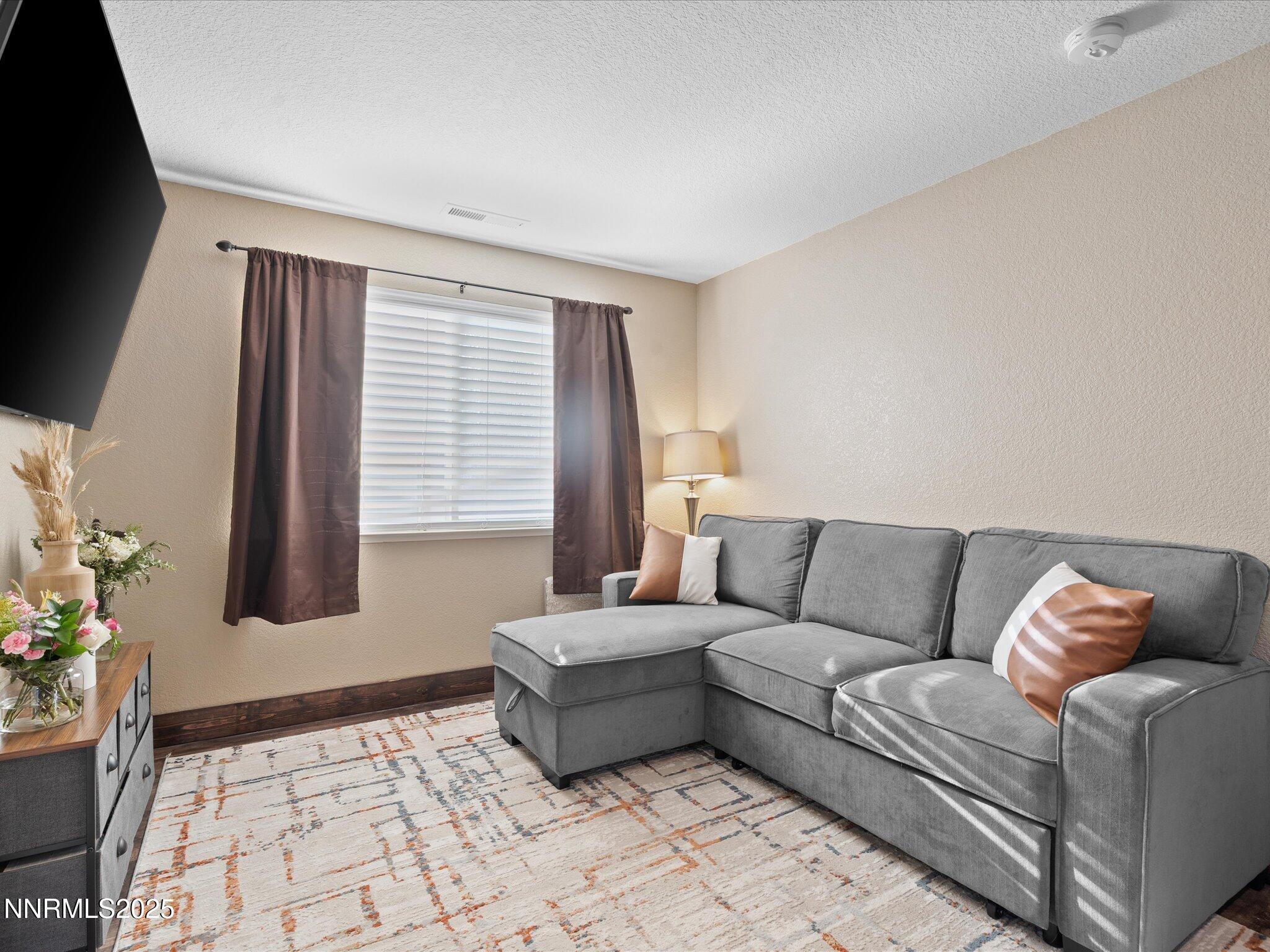 7227 Heatherwood Drive Reno, NV 89523 - Photo 33 of 55 a living room with furniture and window