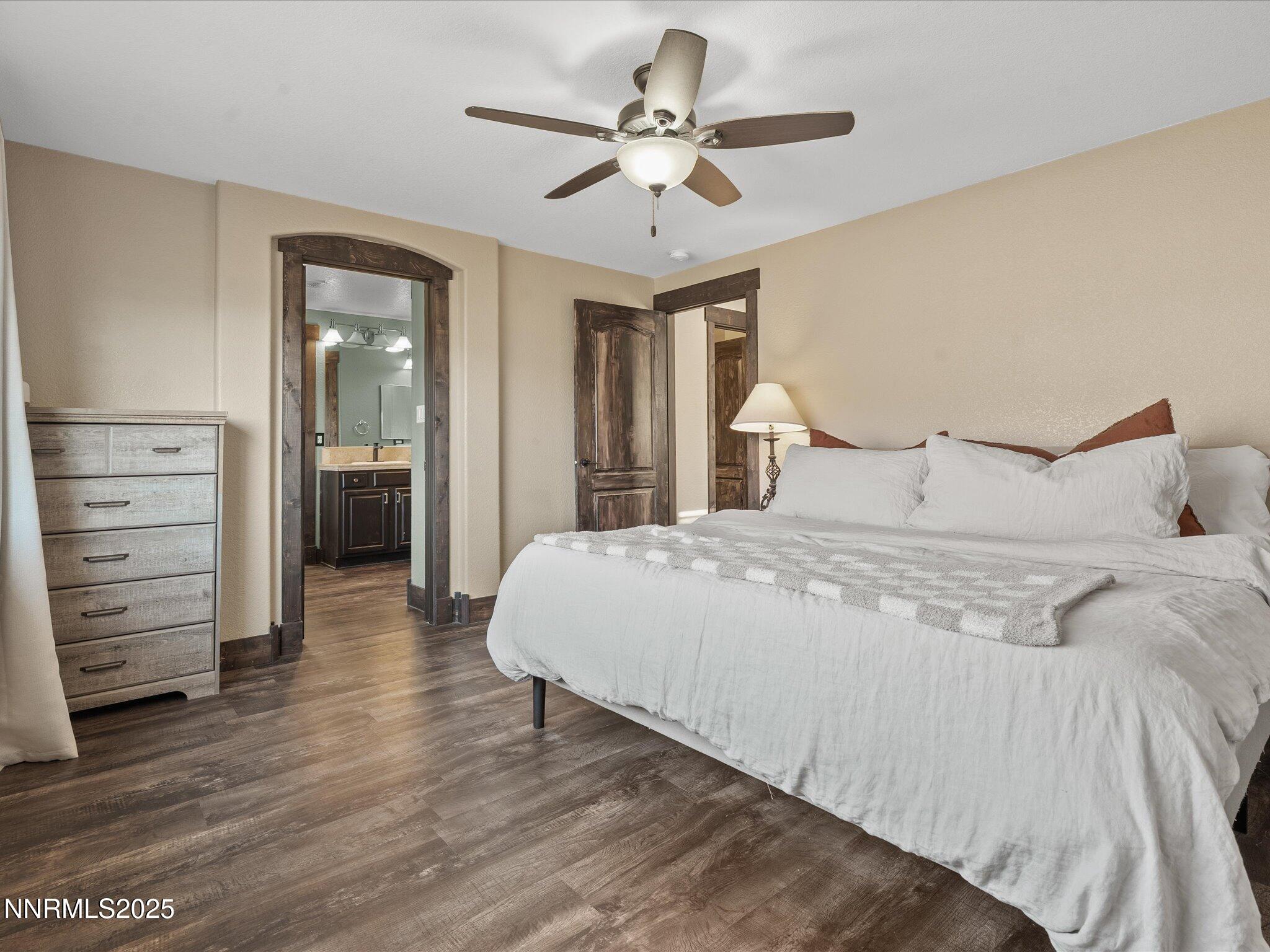 7227 Heatherwood Drive Reno, NV 89523 - Photo 36 of 55 a bedroom with a bed and a ceiling fan