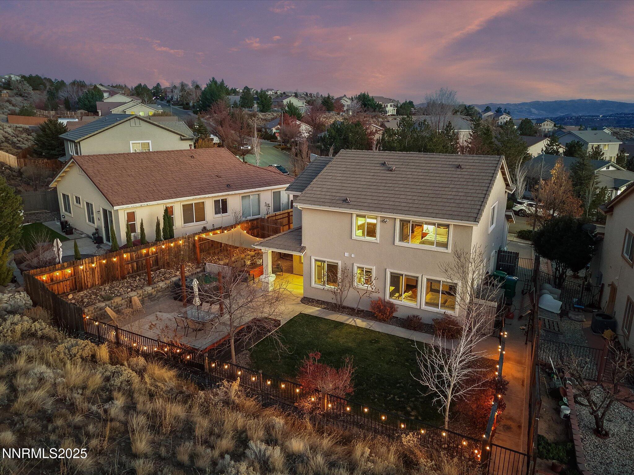 7227 Heatherwood Drive Reno, NV 89523 - Photo 4 of 55 an aerial view of a house with a garden and lake view