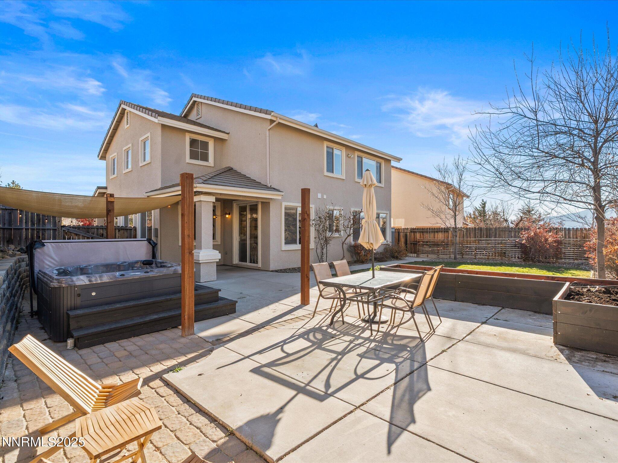 7227 Heatherwood Drive Reno, NV 89523 - Photo 45 of 55 a view of a patio with couches table and chairs and potted plants