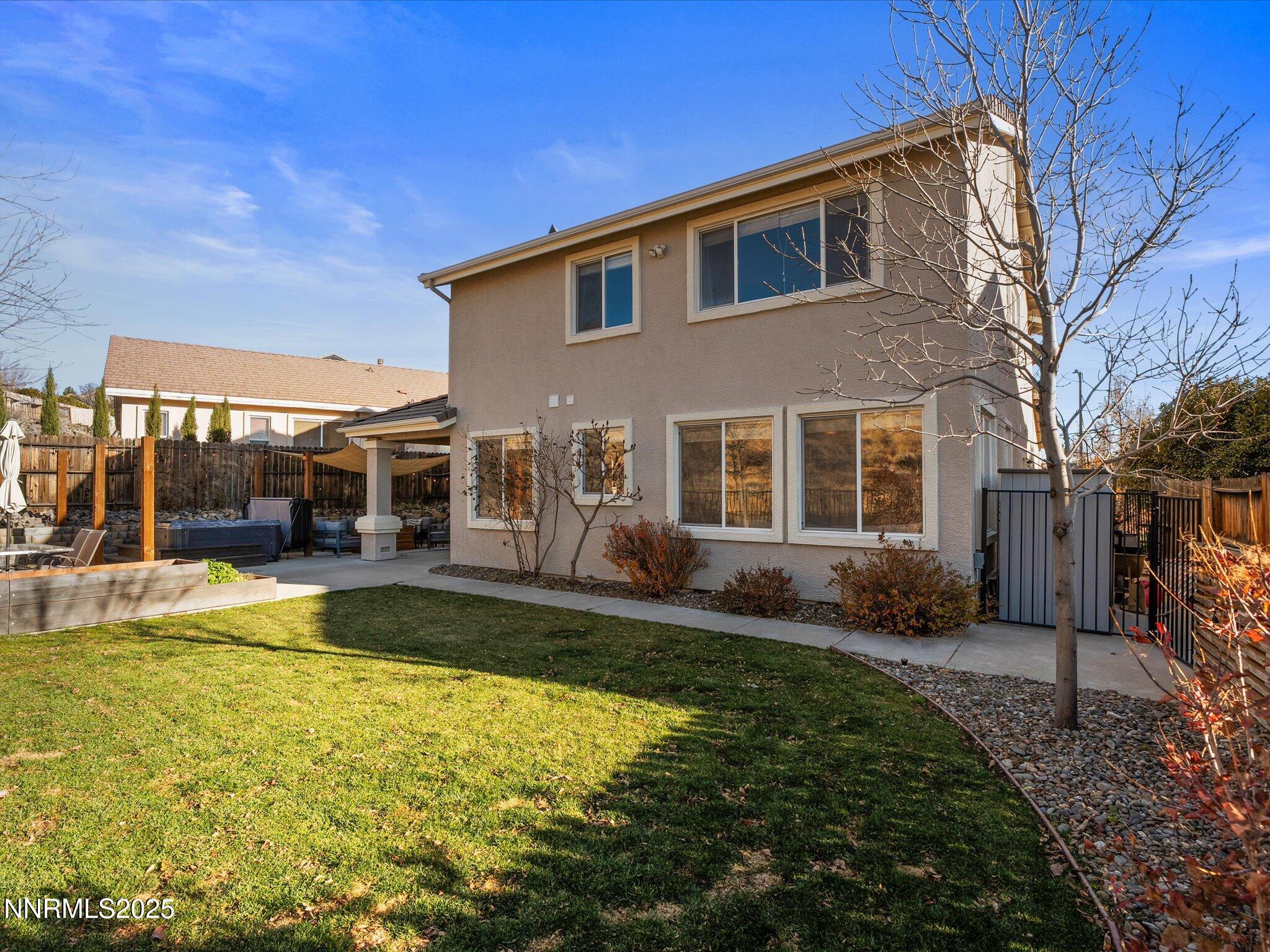 7227 Heatherwood Drive Reno, NV 89523 - Photo 46 of 55 a view of a house with swimming pool and porch with furniture