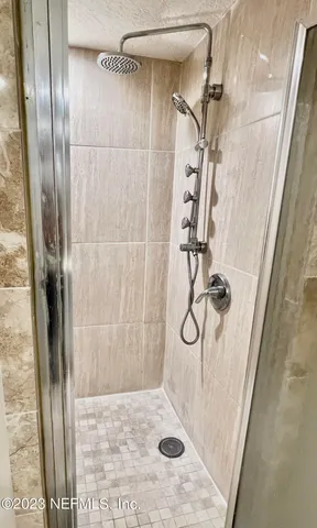 a kitchen with a sink a window and cabinets