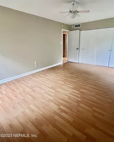 a view of an empty room with a window