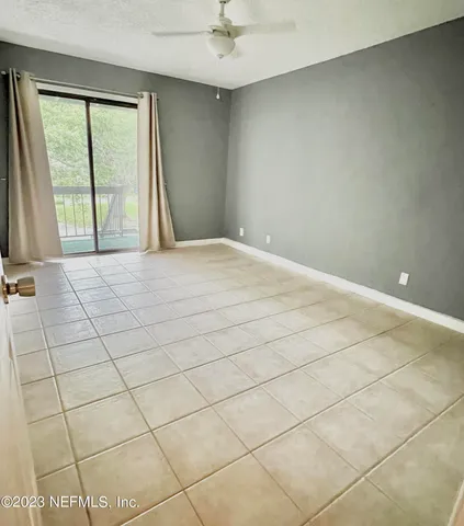 a view of an empty room with a window