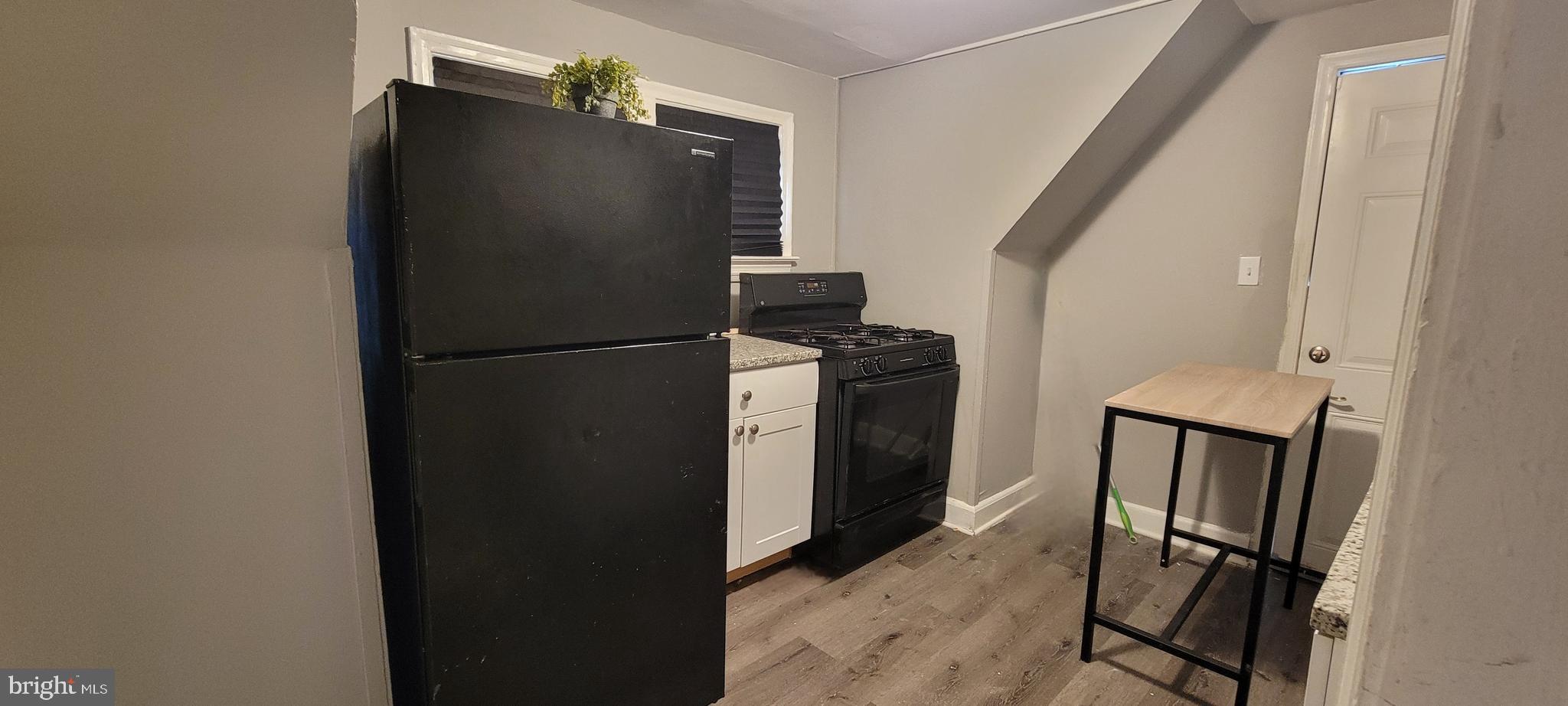 4002 Belvieu Avenue, Unit 3 Baltimore, MD 21215 - Photo 8 of 10 a view of a kitchen from the hallway