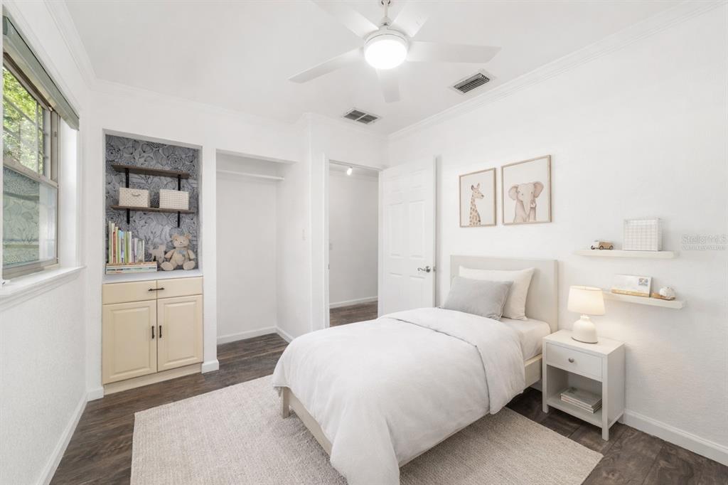5721 Southwest 31st Street Ocala, FL 34474 - Photo 12 of 41 a bedroom with a large bed and a window
