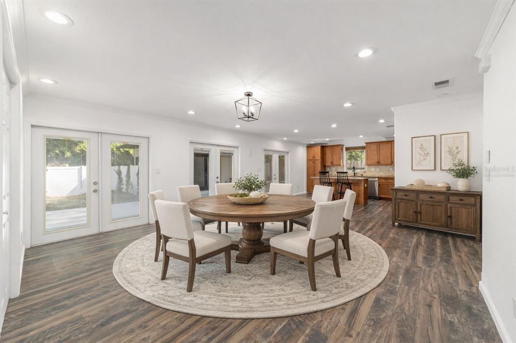5721 Southwest 31st Street Ocala, FL 34474 - Photo 14 of 41 a dining room with furniture and wooden floor