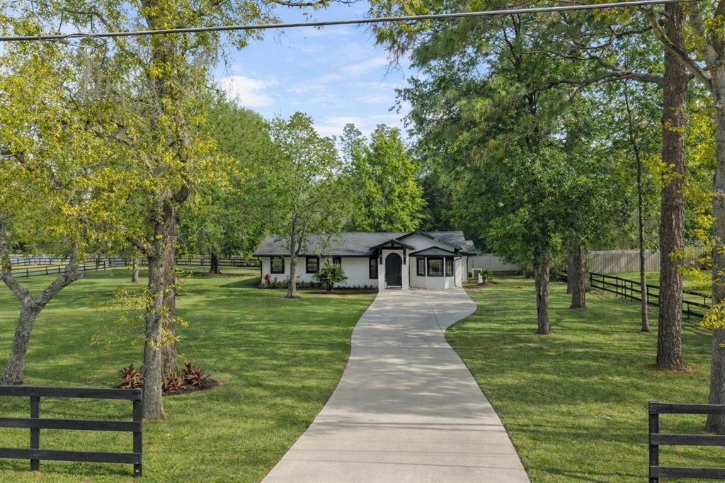 5721 Southwest 31st Street Ocala, FL 34474 - Photo 2 of 41 a front view of a house with a yard
