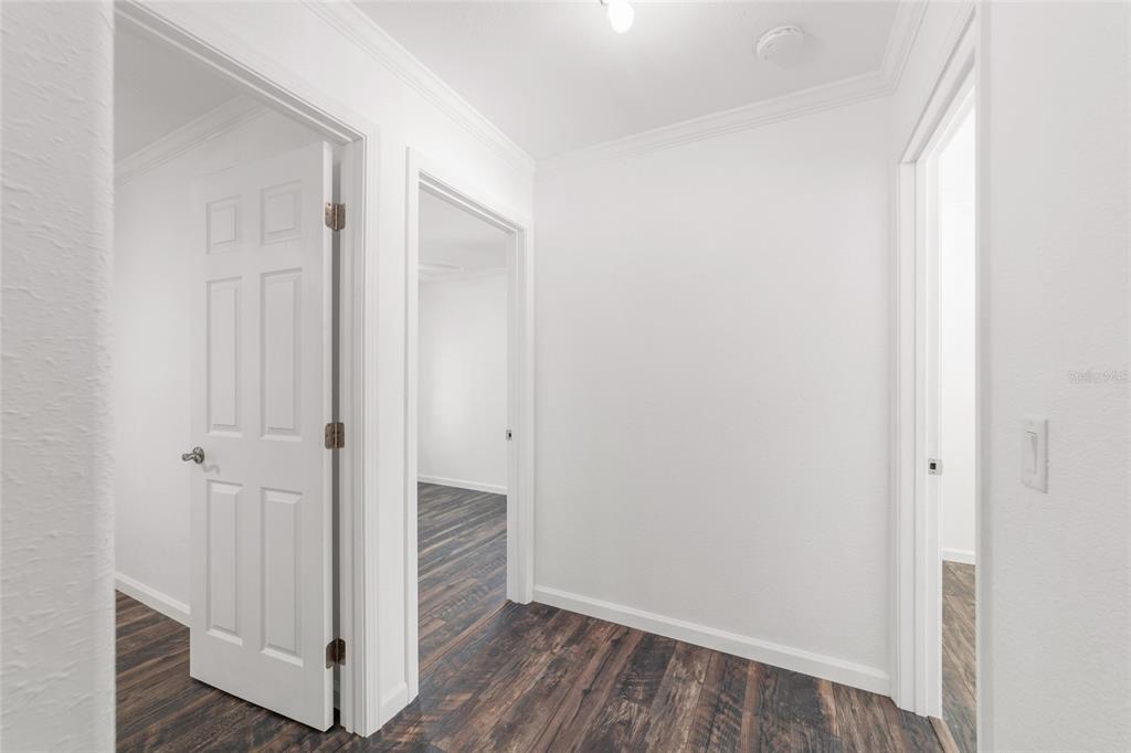 5721 Southwest 31st Street Ocala, FL 34474 - Photo 27 of 41 a view of a hallway with wooden floor