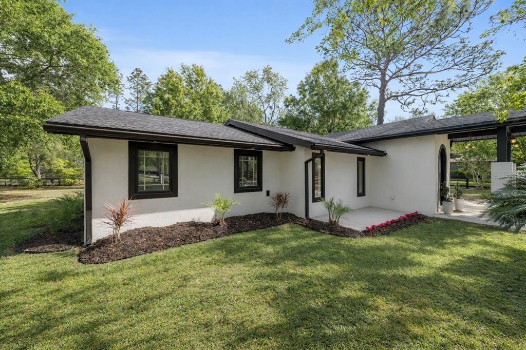 5721 Southwest 31st Street Ocala, FL 34474 - Photo 3 of 41 a house view with a garden space