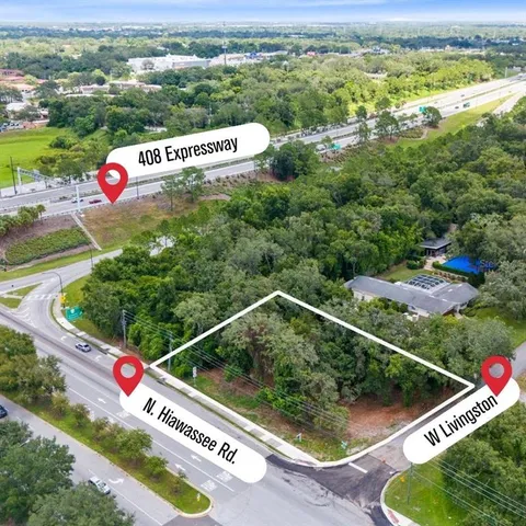 an aerial view of residential houses with outdoor space and river