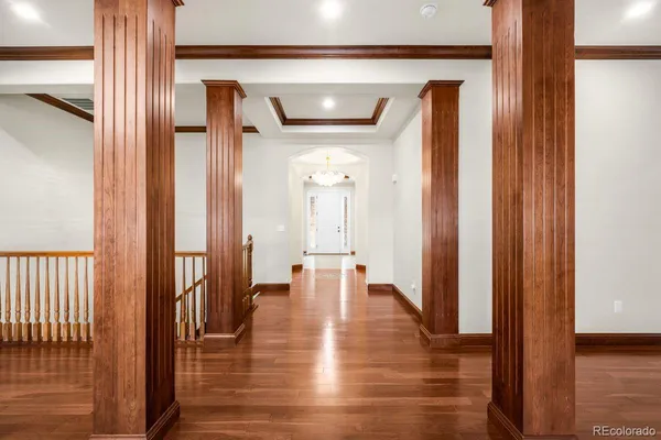 a view of a hallway with a wooden door
