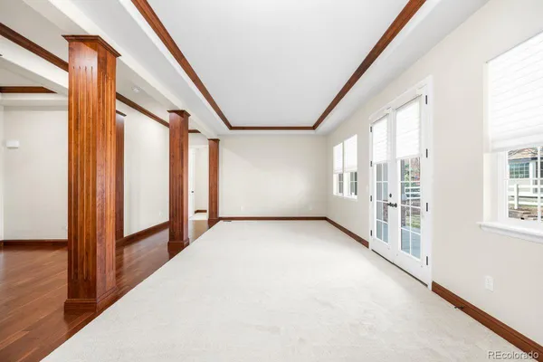 a view of an empty room with windows