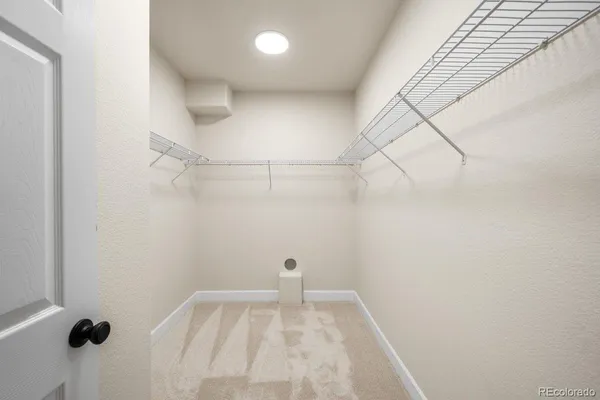 a view of a small space with racks on the wall